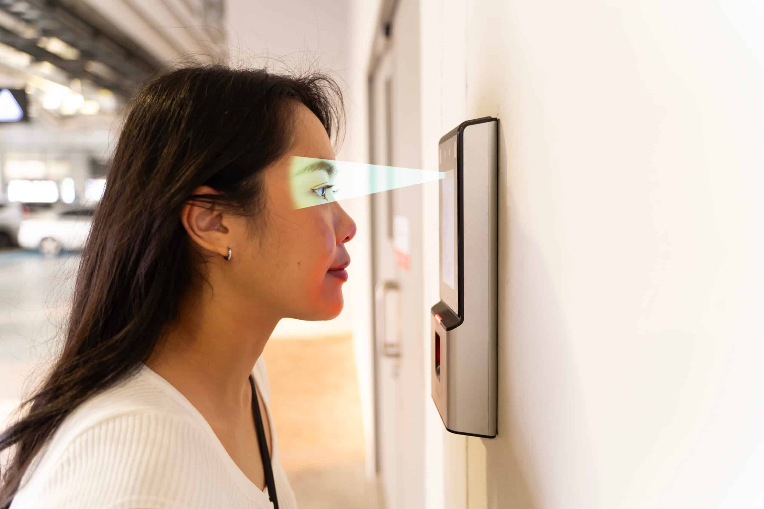 woman enters a location and has an iris scan performed