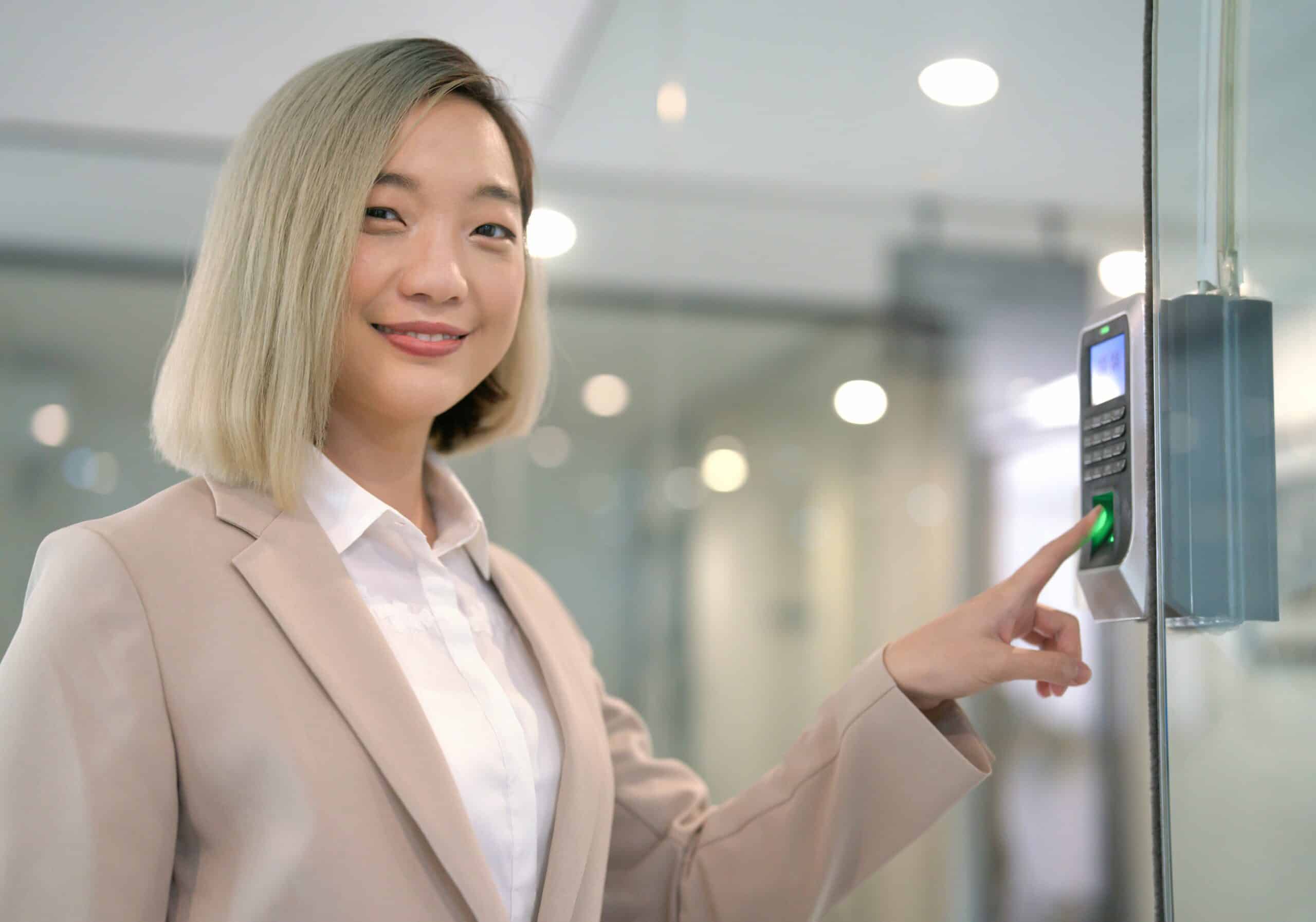 woman entering office with fingerprint scan